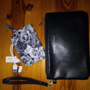 black wristlet/clutch with power supply for devices